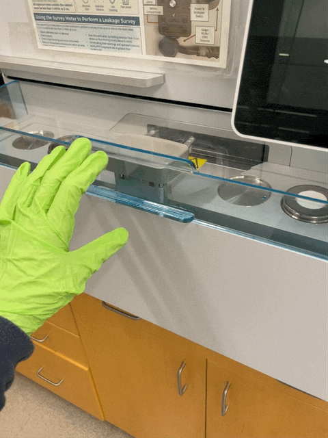 Removing the plastic sample-changer cover.